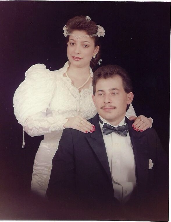 A studio portrait of Ramon and Gracie from their wedding day.